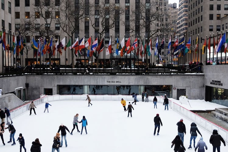 new york winter, people are skating on the rink